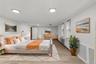 Recessed ceiling lighting, wood-finish flooring, multiple windows with blinds, and white wall finishes