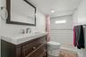 Dark wood-finish vanity with integrated sink