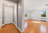 Welcoming sunlit entry foyer to Dining Area and Living Room