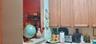 Kitchen featuring wood cabinetry and a passthrough opening