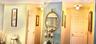Interior hall area featuring two six-panel solid core doors and dual globe-style flush mount light fixtures