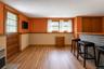 L-shaped family room with door to covered patio.