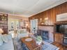 Main living room with woodburning fireplace