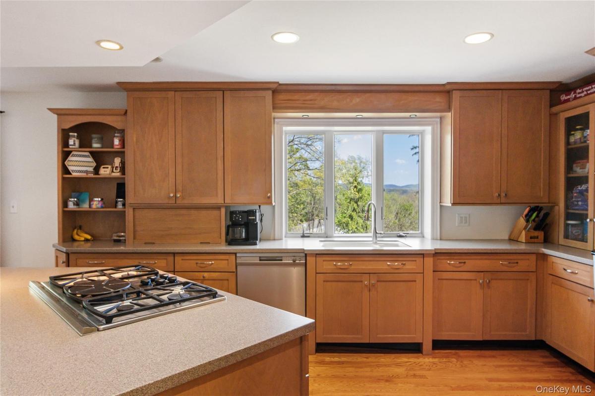 Gourmet Kitchen tons of cabinet space and window overlooking the yard and view