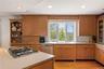 Gourmet Kitchen tons of cabinet space and window overlooking the yard and view