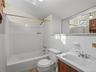 One of three full bathrooms