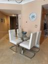 Neutral-toned interior featuring large-format tile flooring, crown molding, and recessed lighting
