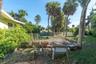 Large side yard with garden space, room for the kids and dogs to play or a game of cornhole. Lot size is 9,424 square feet if you want to renovate or 