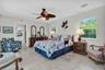 Private primary bedroom with large walk-in closet and en-suite bath has a lot of space to sit and relax.
