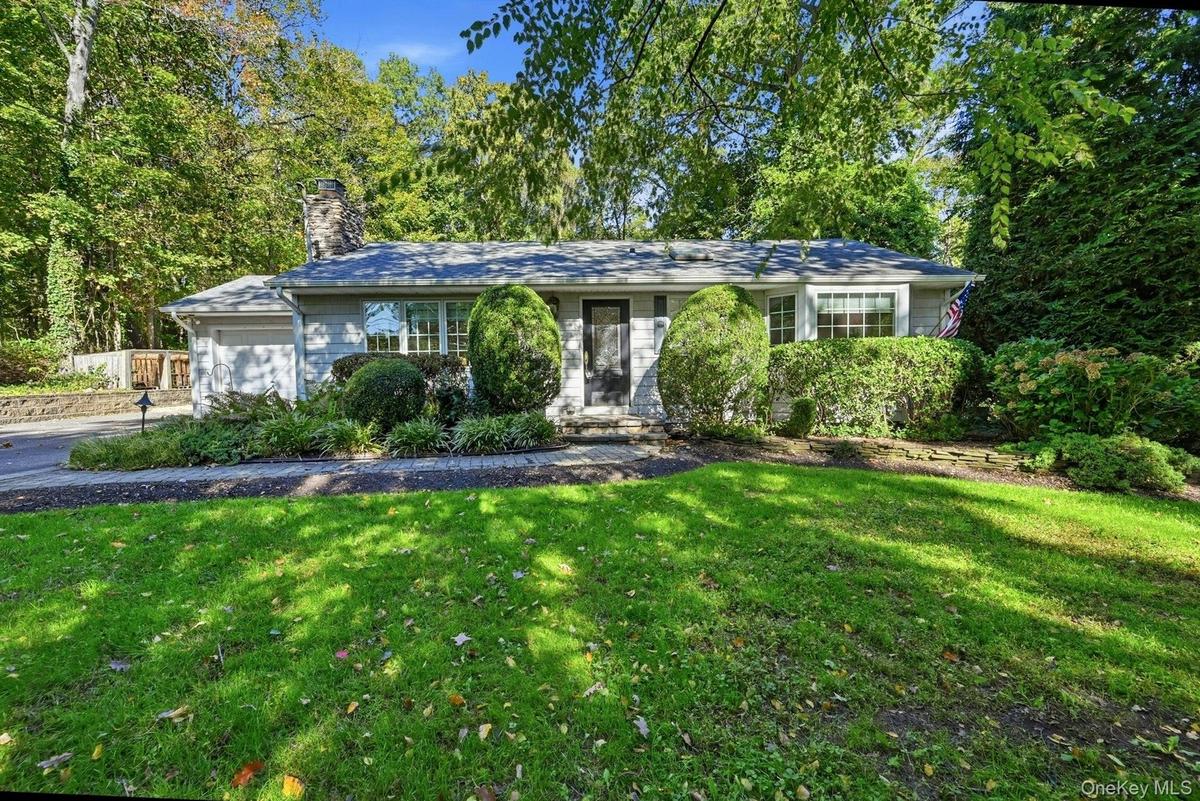 Expanded ranch set on private .35 level lot.