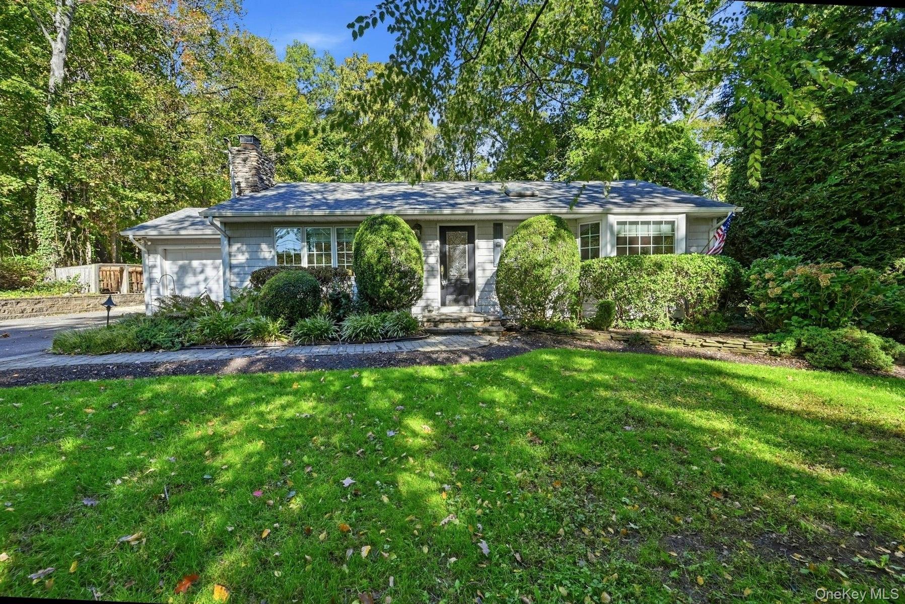 Expanded ranch set on private .35 level lot.