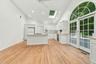 Ceiling fan, hardwood floors throughout, entrance to garage. Recessed lighting.