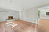 Living room with wood burning fpl.
