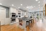 Chefs kitchen, high ceiling, French doors to expansive deck and property