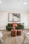 Wood-finish tile flooring, neutral wall palette, and recessed circular ceiling light fixtures
