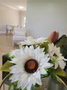 Neutral wall tones, wood-finish flooring, and crown molding