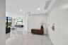Polished stone-finish flooring, floor-to-ceiling windows, and recessed lighting