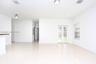 Open-concept interior featuring light-toned tile flooring, recessed lighting, flush-mount ceiling fixtures, and French doors