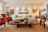 Living area featuring recessed ceiling lighting, crown molding, and wood-finish flooring