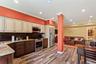 LEGAL ACCESSORY APARTMENT featuring Kitchen with appliances with stainless steel finishes, cream cabinets, open floor plan, tasteful backsplash, and l
