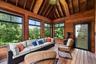 Sunroom with outdoor lounge area and lofted ceiling