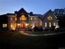 View of front of property featuring a nighttime view
