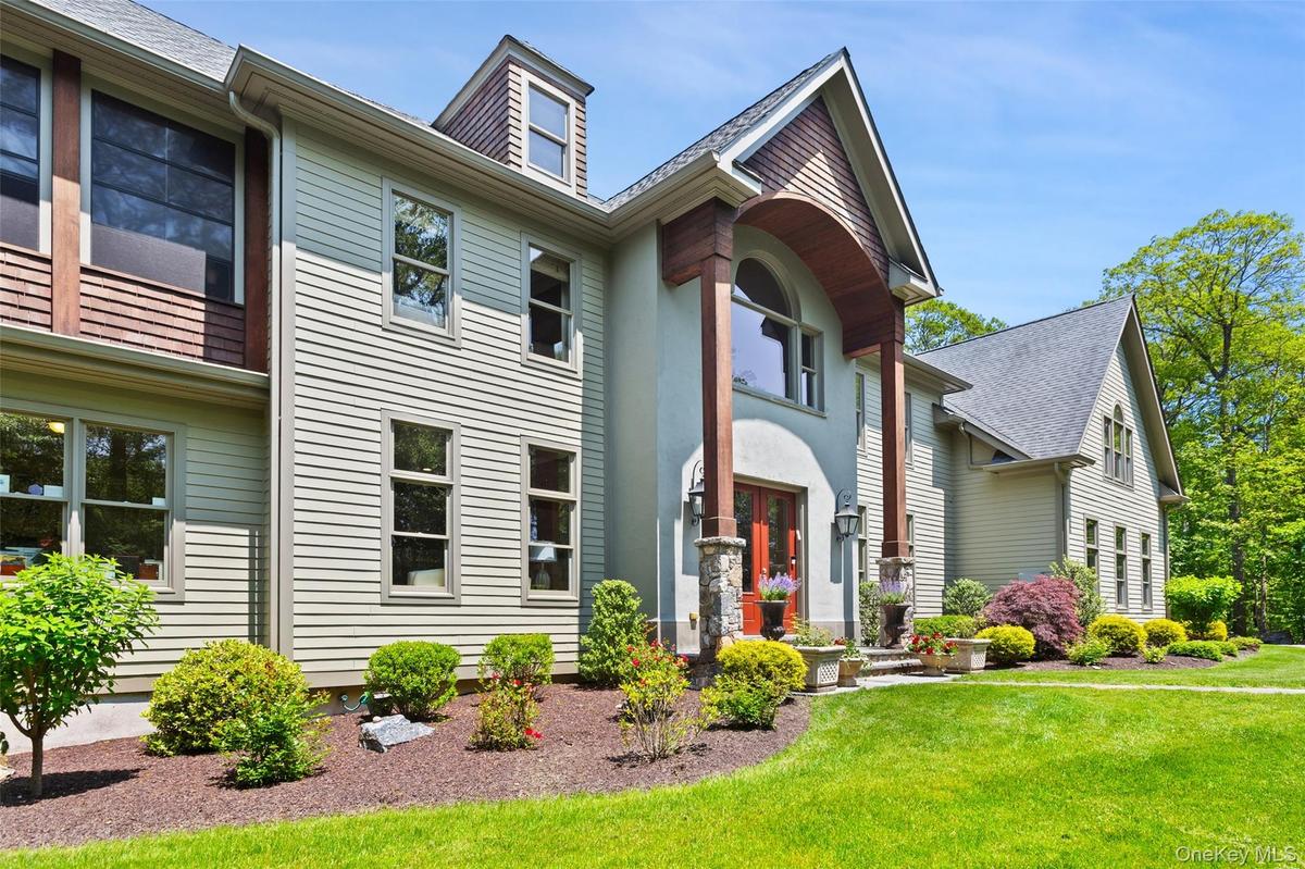 View of front of property with a front lawn