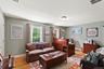 Bedroom with light wood-style flooring, baseboards, and an office area
