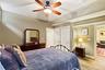 Bedroom featuring light wood-style flooring, baseboards, a closet, and ceiling fan
