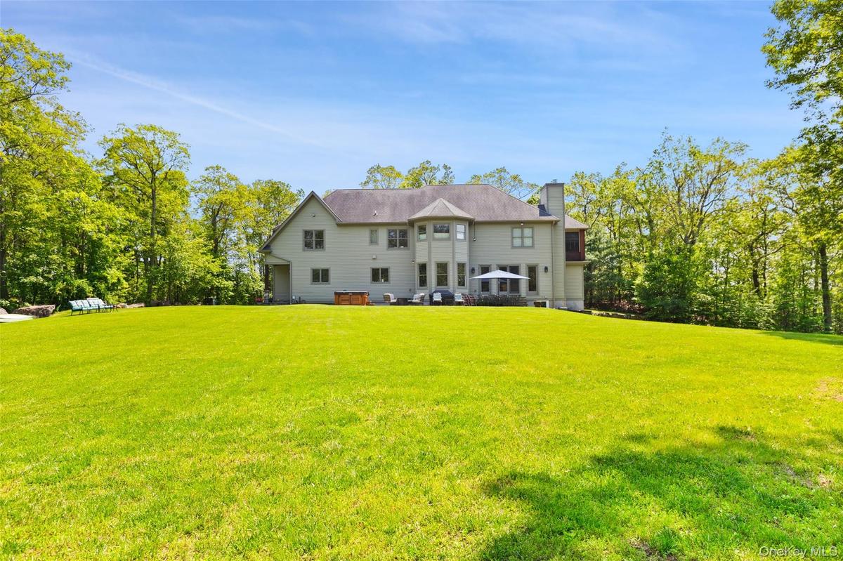 Back of property featuring 3.47 level acres