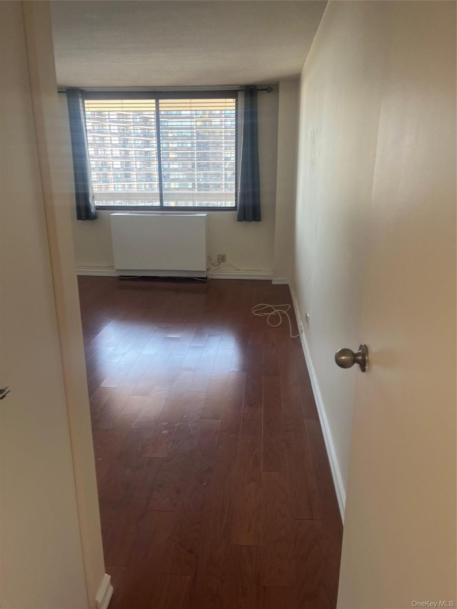 Large bedroom. Wood floors.