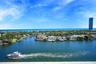 Panoramic waterfront location featuring deep-water canal access, mature landscaping, and an open horizon toward the ocean