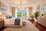 Hardwood flooring, crown molding, ceiling medallion, drum pendant light fixture, and floor-to-ceiling glass panel doors
