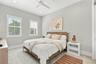 Bedroom featuring neutral wall paint, recessed lighting, carpeted flooring, and two windows equipped with white plantation shutters and a ceiling fan