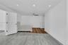 Interior space featuring recessed lighting, a ceiling fan, and distinct wood-finish flooring