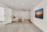 Wood-finish flooring, recessed lighting, and a modern ceiling fan