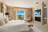 Primary Bedroom with fireplace and intracoastal views