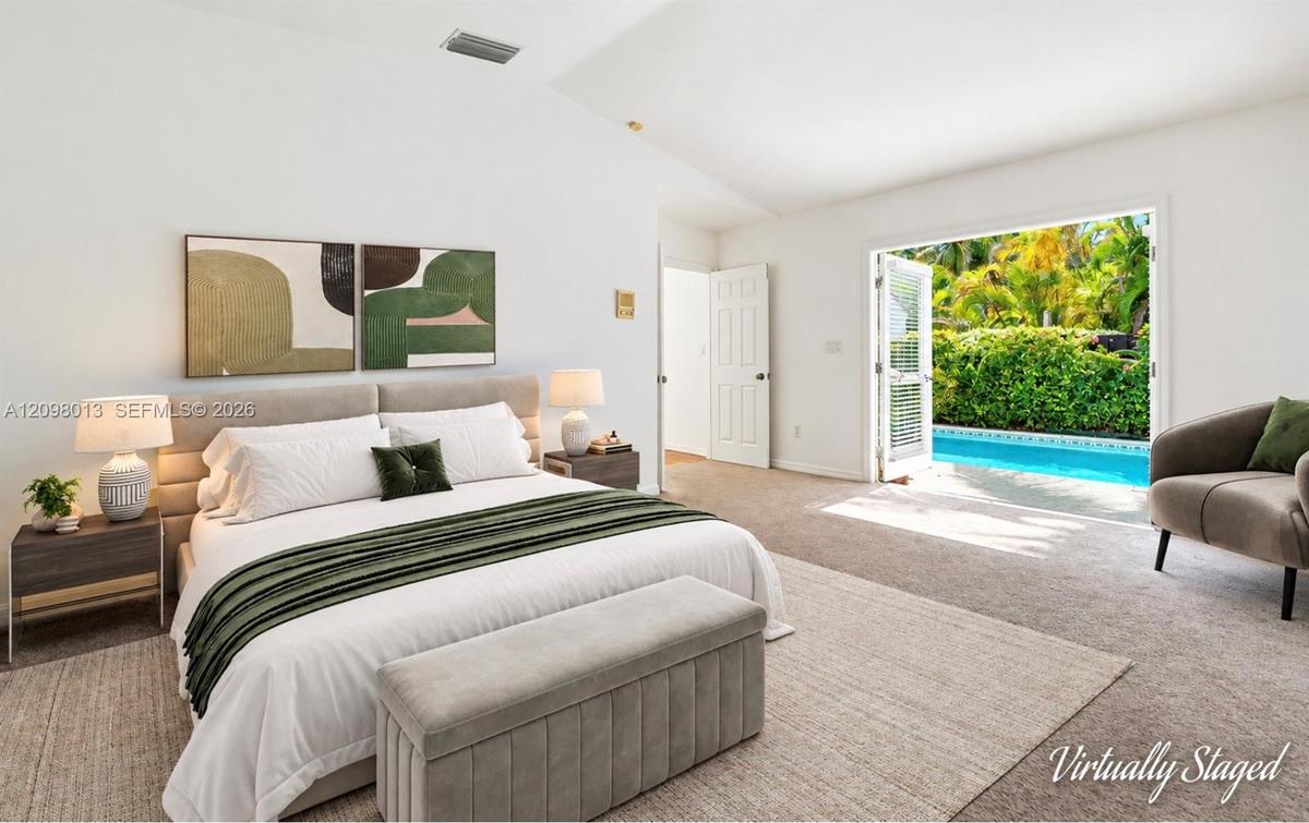 Vaulted ceilings, and French doors opening to swimming poolVirtually staged photo