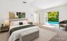 Vaulted ceilings, and French doors opening to swimming poolVirtually staged photo