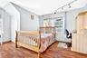 Another view of the extremely bright 3rd Bedroom with hardwood flooring and closets.
