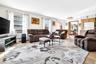You'll be amazed when you step into this cavernous and Sunlit Living Room, featuring lots of Andersen Windows, hardwood flooring, and a warm brick Fir