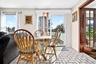 Right off the kitchen, there is a breakfast area and glass sliding doors to the huge deck.