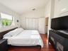 Vaulted ceiling, wood-finish flooring, and built-in closet storage