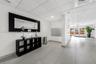 Lobby featuring tile flooring, a drop-tile ceiling with recessed lighting, and a wall-mounted metal mail station
