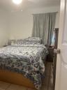 Room featuring neutral wall finishes, tile flooring, and a ceiling-mounted light fixture