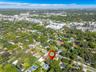 Aerial view highlighting the home's private setting surrounded by lush greenery