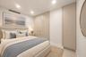 Built-in floor-to-ceiling cabinetry with integrated hardware, recessed ceiling lighting, and smooth-finish interior walls