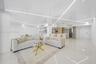 High-gloss, reflective ceiling featuring integrated geometric linear lighting