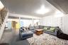 Living room with finished concrete floors and stairs