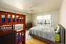 Bedroom featuring light wood-type flooring and a ceiling fan